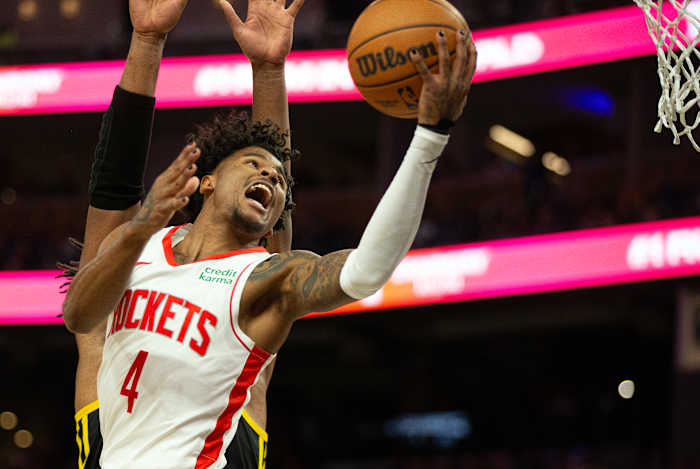 Rockets guard Jalen Green drives against Golden State Warriors forward Kevon Looney (5) during the third quarter at Chase Center.